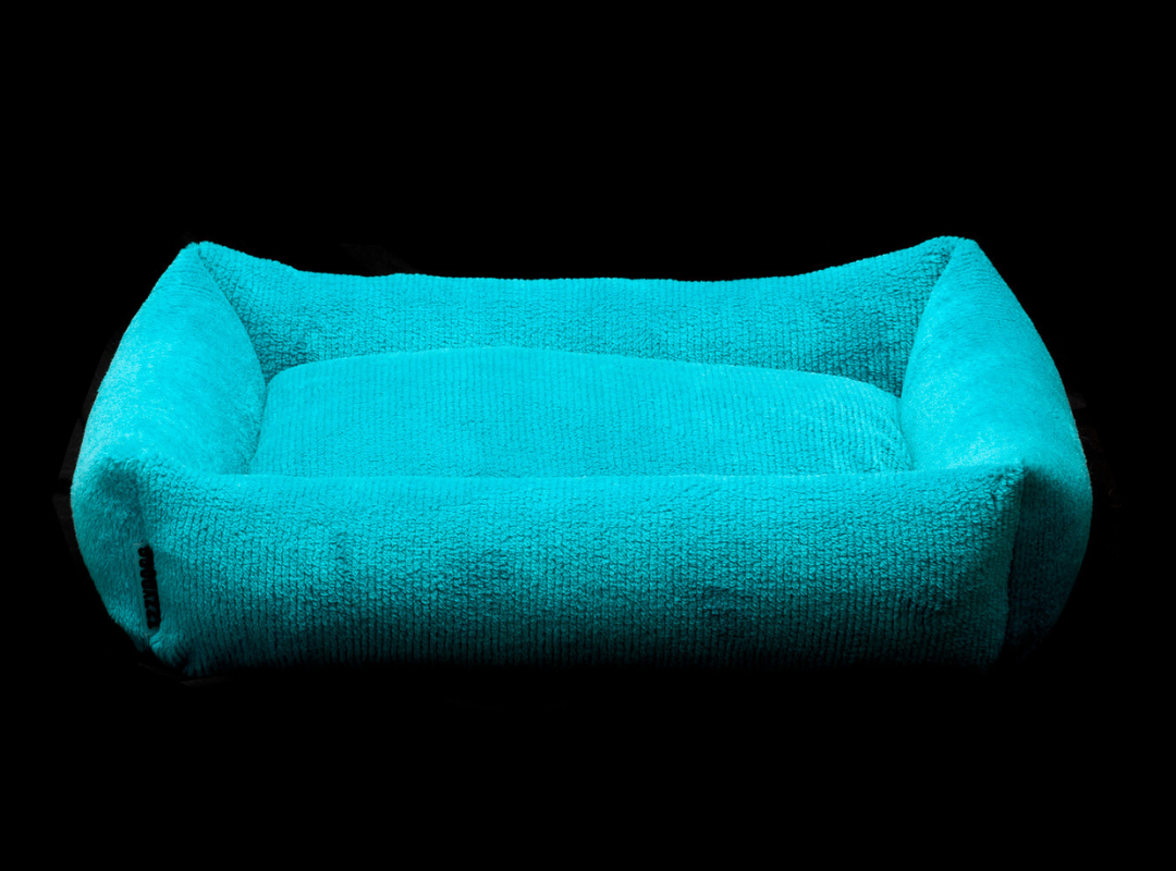 Izzydogg design dog bed with head rest in sapphire blue recycled fluffy faux fur with removable cover and high quality memory foam.