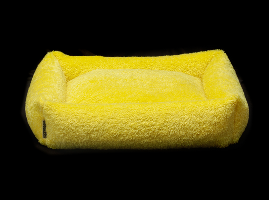 Izzydogg design dog bed with head rest in canary yellow recycled fluffy faux fur with removable cover and high quality memory foam.