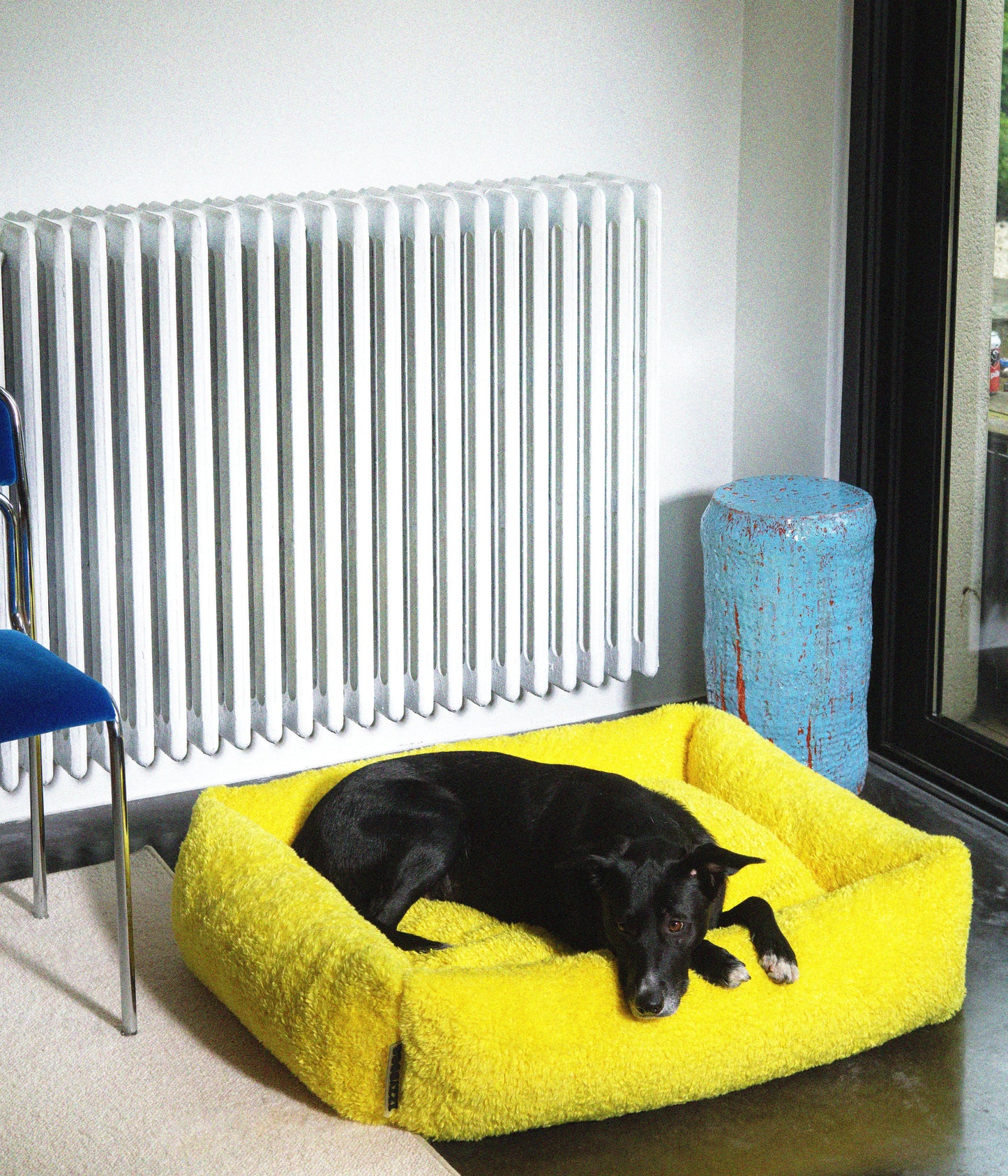 Izzydogg design dog bed with head rest in canary yellow recycled fluffy faux fur with removable cover and high quality memory foam.